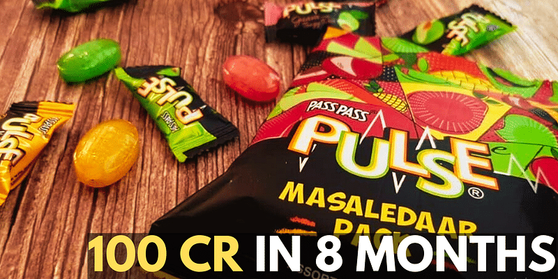 Pass Pass Pulse candies scattered on a table, showcasing the brand's rapid success with the text "100 CR in 8 months.