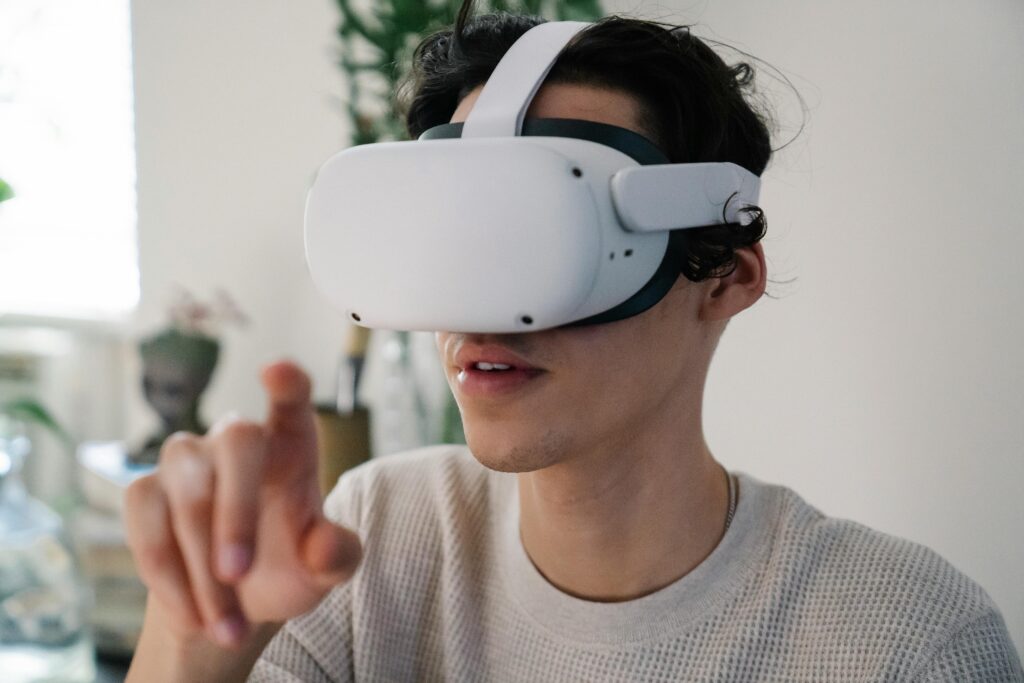 While this image depicts a virtual reality headset, it represents the broader immersive technology landscape that includes AR. The user's interaction with the device illustrates the hands-on, engaging nature of immersive technologies used in marketing campaigns.